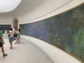 PARIS, FRANCE Ã¢â¬â July 25, 2019: Visitors admire giant paintings by impressionist painter Claude Monet Water Lilies at Paris